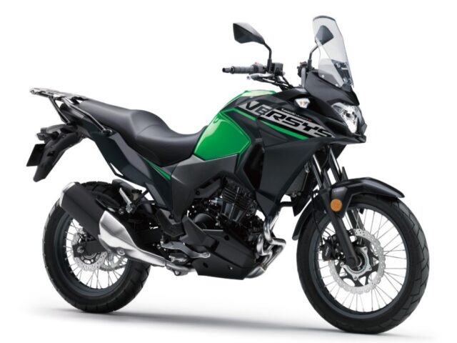 Kawasaki Versys-X 300 ABS motorcycle in lime green with a sporty design and off-road tires, front view.