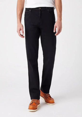 Black Wrangler Texas Stretch Jeans by PRO, showcasing a close-up of the fitted, durable denim fabric and classic design.