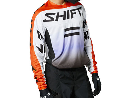 Black and white fade MX jersey from SHIFT's WHIT3 Label collection with orange accents, featuring a sleek, sporty design.