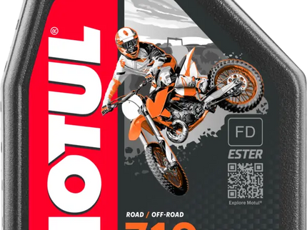 Motul 710 2T 1Lt bottle of high-quality 2-stroke engine oil from MOTUL, with label and cap visible.