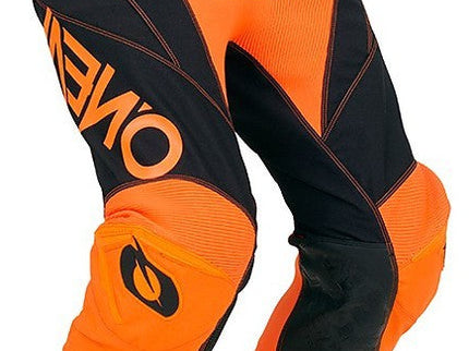 Orange ONEAL MX Mayhem Hexx MX pants with reinforced knee panels and durable motocross fabric for enduro riding.