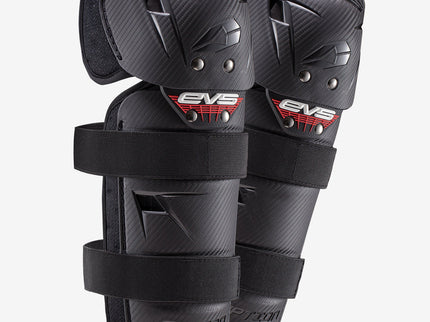 Pair of EVS Option Knee Guards showing black protective knee pads with adjustable straps for motorcycle or sports use.