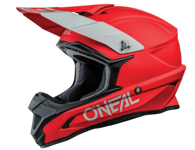 O'NEAL MX helmet in red with sleek design, featuring ventilation and sturdy construction for motocross riding.