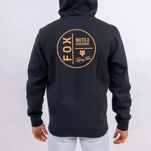 FOX Circular Zip Hoody in black, featuring a front zipper and FOX logo, displayed on a hanger against a plain background.