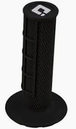 ODI Half Waffle Lock-On grips shown on a bicycle handlebar, featuring textured grip surface for improved control.