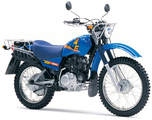 Yamaha AG 200 motorcycle in a side view, showing its blue body, seat, handlebars, and rugged tires.