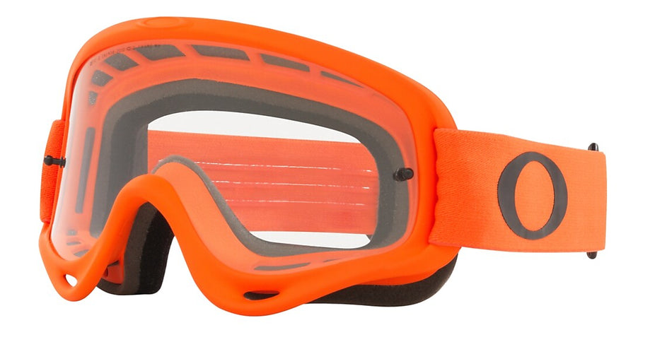 Oakley O-Frame MX Goggle in orange with clear lens, designed for motocross riders, showing the durable frame and adjustable strap.