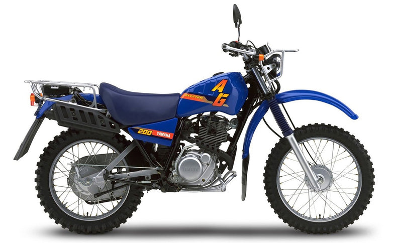 Yamaha AG 200 motorcycle with black body and rugged design, displayed from a side angle in a clear outdoor setting.