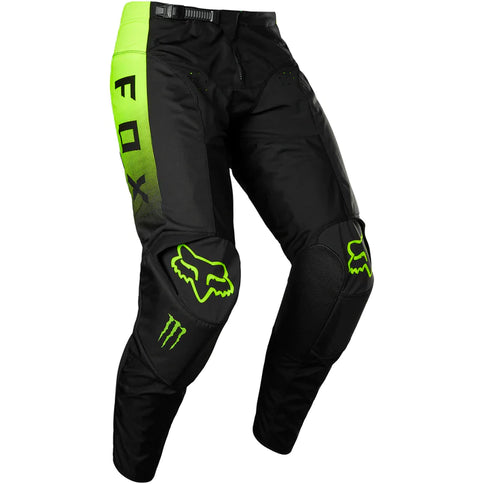 Black and green FOX MX 180 Monster Pants for motocross, featuring durable fabric and adjustable waist for riding comfort.