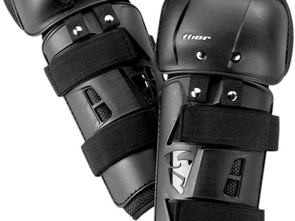 Black THOR SECTOR adult knee guard showing padded knee protection with adjustable straps for secure fit.