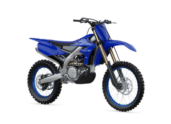Yamaha YZ450FX off-road motorcycle shown in a side view with racing decals and rugged tires for off-road riding.