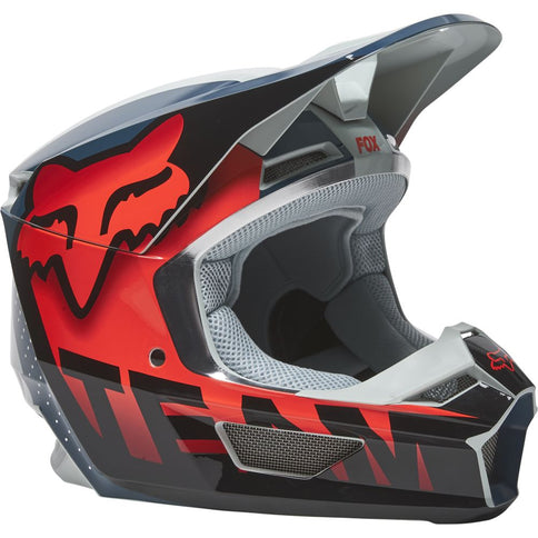 FOX V1 Trice MX helmet in grey and orange with MIPS protection, designed for motocross riding.