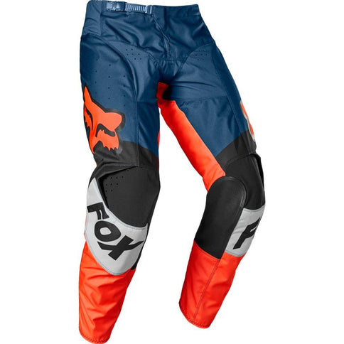 FOX 180 Trice MX pants in orange, black, and blue with reinforced knee areas and adjustable waist for motocross riding.