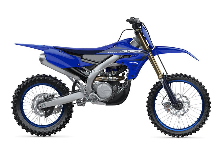 Yamaha YZ450FX 2025 dirt bike with rugged off-road tires and sleek blue and white body design.