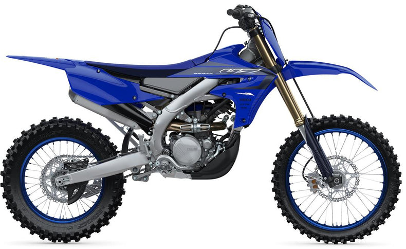 Yamaha YZ250FX dirt bike with blue and black body, off-road tires, and racing decals, shown from a side angle.