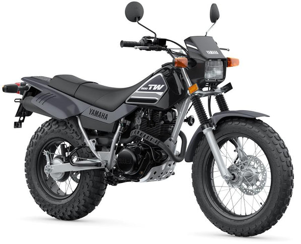 Yamaha TW200 dual sport motorcycle with black seat and rugged tires, ready for off-road and on-road adventures.