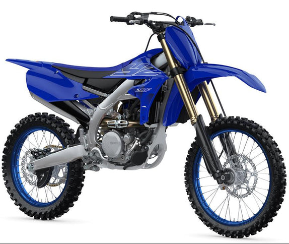 Yamaha YZ450F motocross motorcycle with blue body, knobby tires, and racing design, ready for off-road riding.