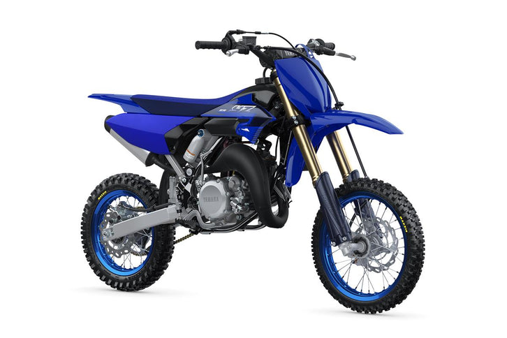 Blue Yamaha YZ65 2023 dirt bike with knobby tires, front suspension, and off-road design, viewed from a side angle.