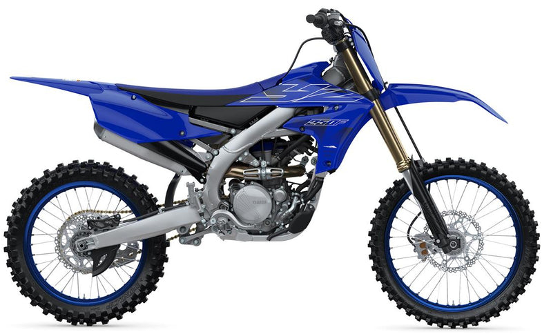 Yamaha YZ450F motocross motorcycle shown from the side with black and red bodywork and off-road tires.