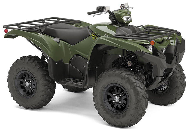 Yamaha YFM 700 Grizzly ATV motorcycle parked outdoors, rugged design with large tires and front rack for off-road use.